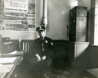 Chief Francis Funk with the WPD's first police radio in 1940