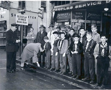 Mayor Clowe and Police Chief Boyd participate in the block of dimes project with local Boy Scouts in the 1950's